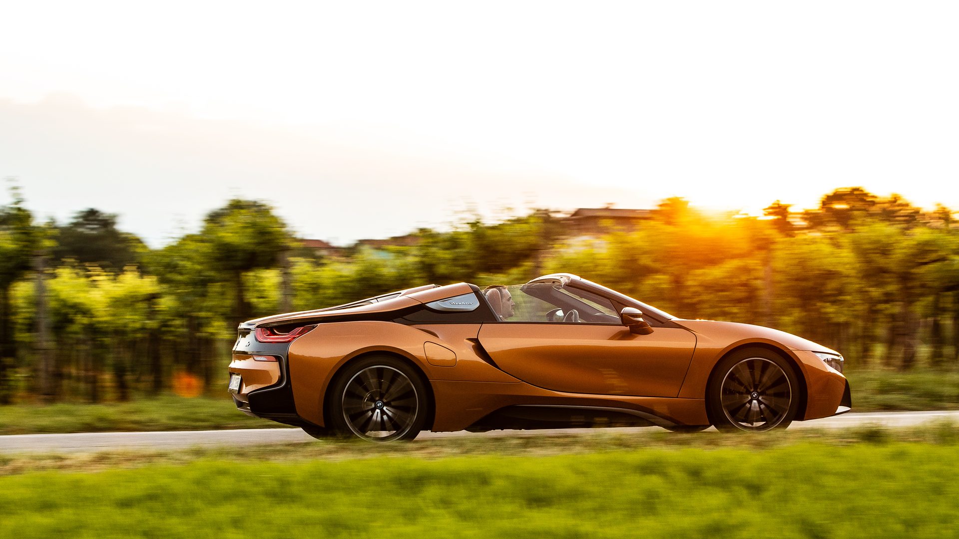 BMW i8 Roadster side view sunset